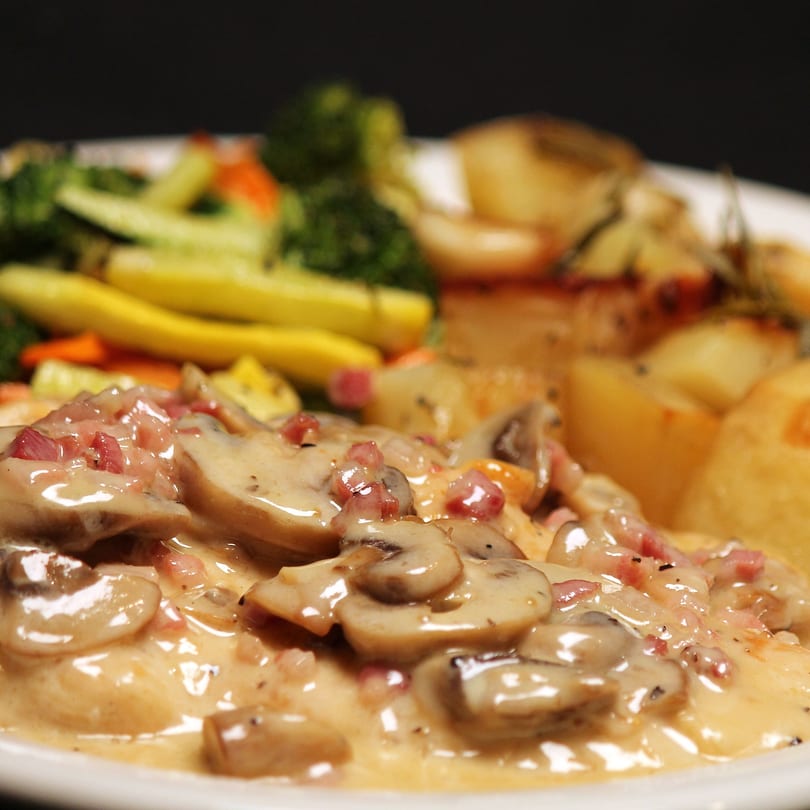 Creamy mushroom and bacon sauce over chicken, with roasted vegetables and potatoes.